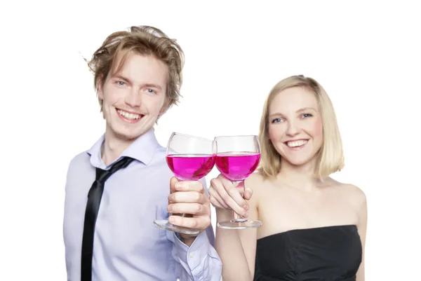 stock image Young couple toasting with pink drink