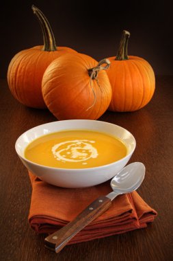 Delicious pumpkin soup with cream clipart