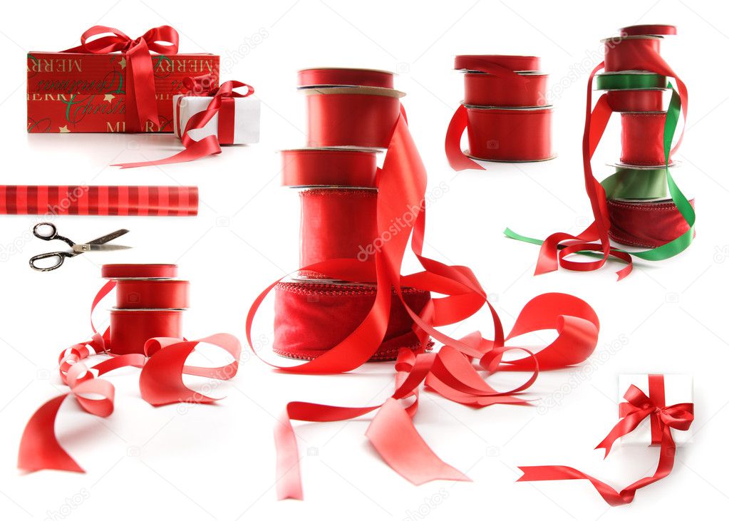 Different sizes of red ribbons and gift wrapped boxes on white
