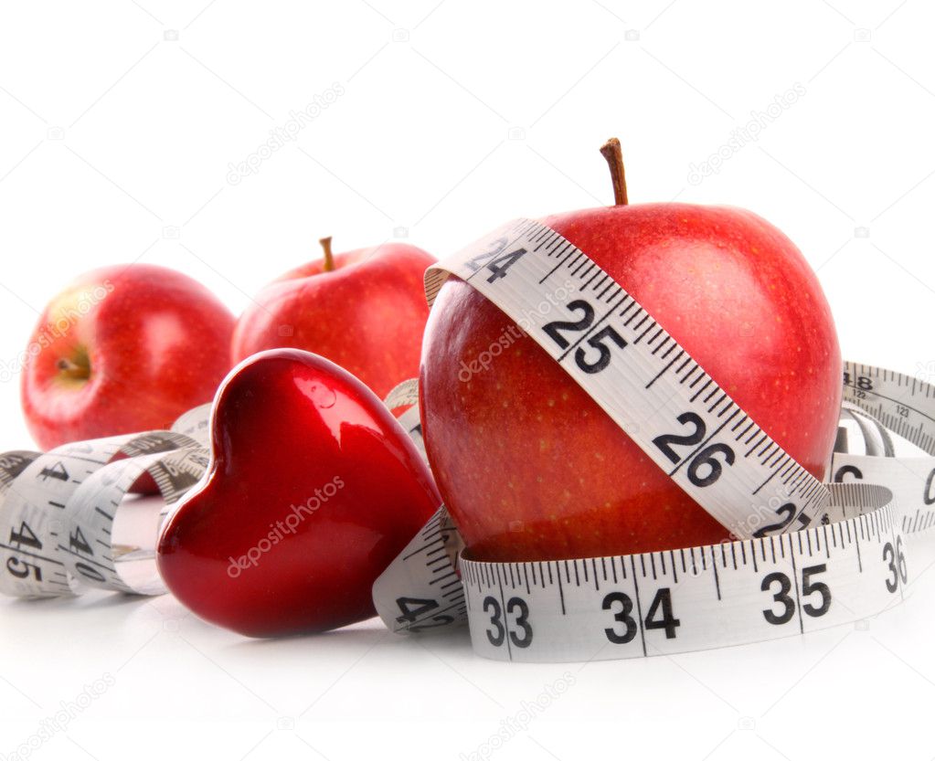 Red apples,heart and measuring tape on white background