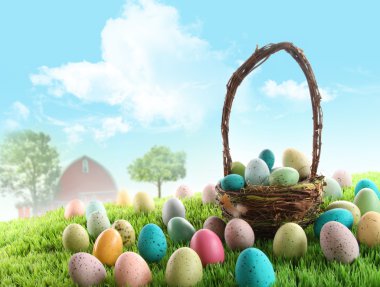 Colorful easter eggs in field of grass clipart