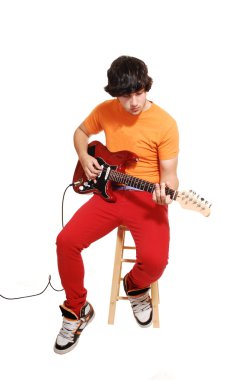 Teen boy with guitar. clipart