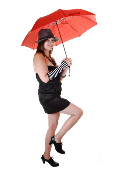 Dame met hoed en een paraplu. — Stockfoto