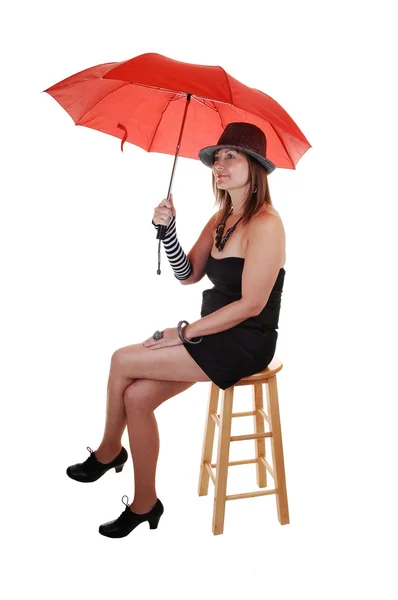 Dame met hoed en een paraplu. — Stockfoto
