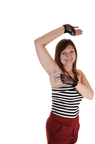 Meisje deodorant zetten. — Stockfoto