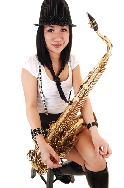 Young Asian Woman Sitting Studio Playing Saxophone Shorts Suspender Hat — Φωτογραφία Αρχείου