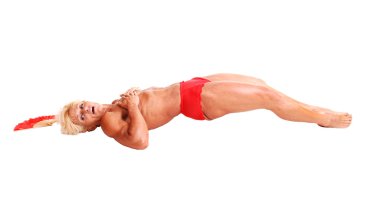 A blond muscular bodybuilding woman lying in the studio shooing her strong legs and the upper body and arms, topless, over white background. clipart