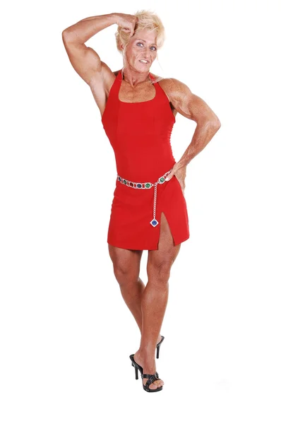 Blond Bodybuilding Girl Standing Studio Red Dress Shooing Her Very — Stock Photo, Image