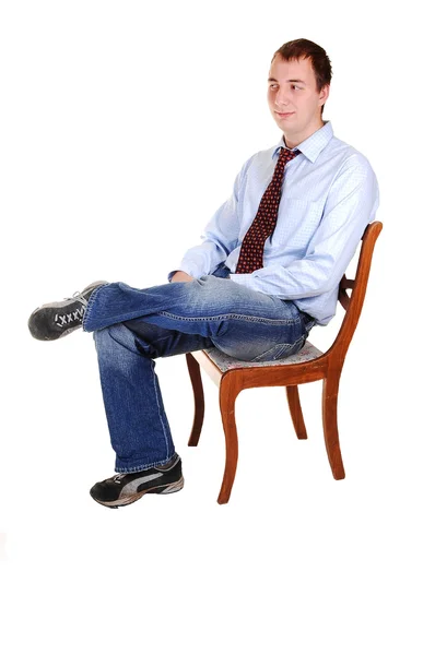 Young Teenager Jeans Blue Dress Shirt Tie Sitting Chair Studio — Stock Photo, Image