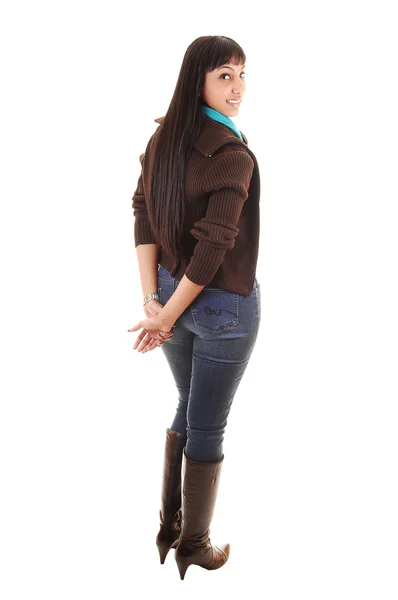 Piękna Kobieta Stojąc Powrotem Aparatu Dżinsy Brązowy Sweter Oraz Buty — Zdjęcie stockowe