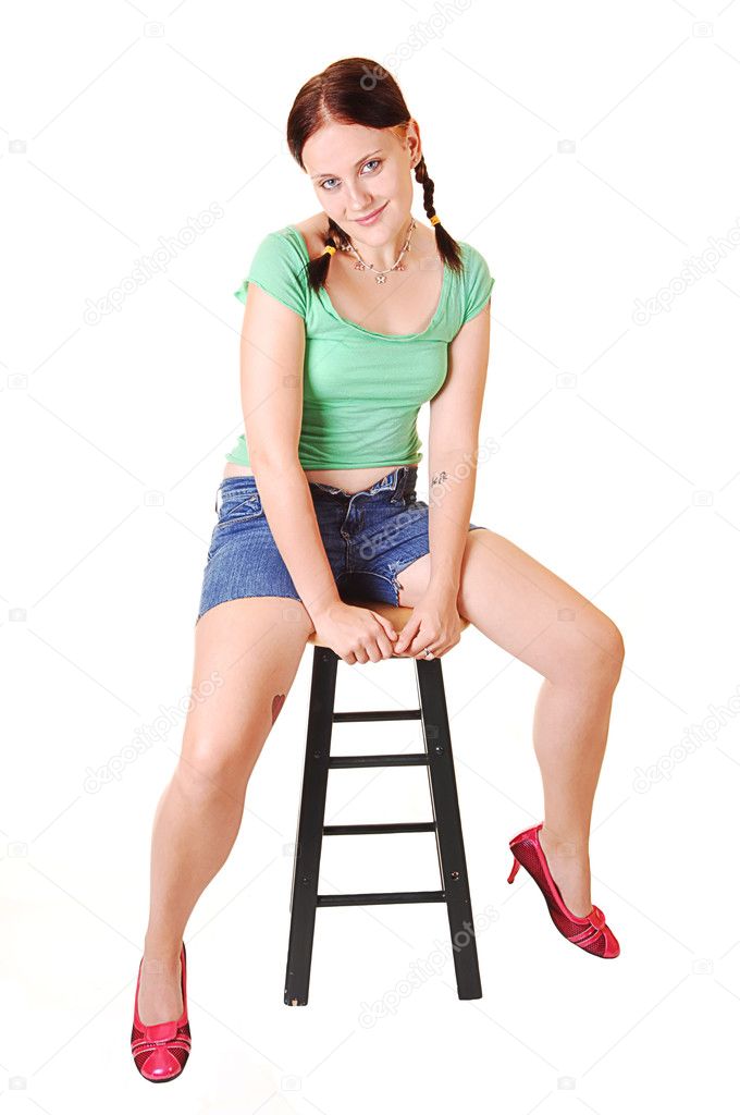 Pretty girl sitting on bar chair. — Stock Photo © sucher #4661777