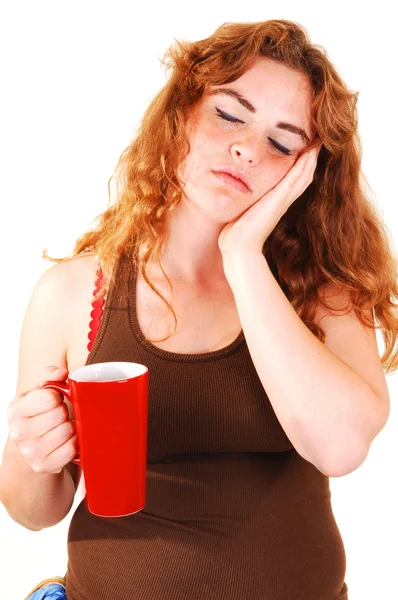 Sleeping girl with coffee. — Stock Photo, Image