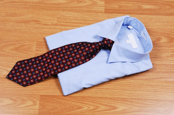 Light Blue Dress Shirt Wood Surface Red Black Tie Sale — Stock Photo, Image