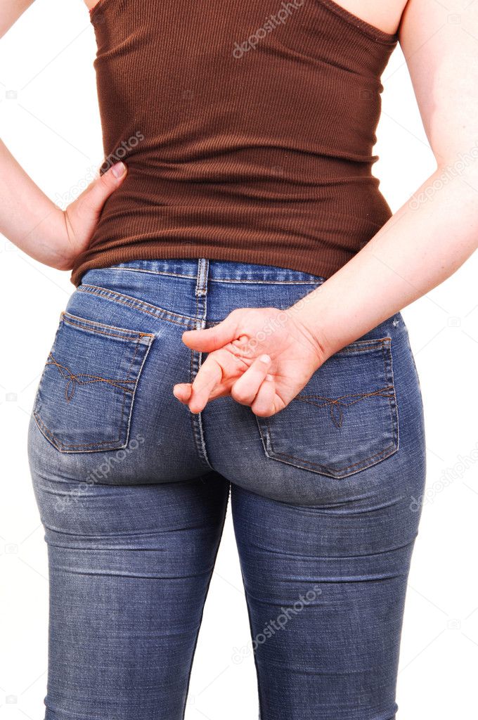 The back of a young girl, in a brown top and blue jeans, with the nice round butt and the right hand with the grossed fingers.