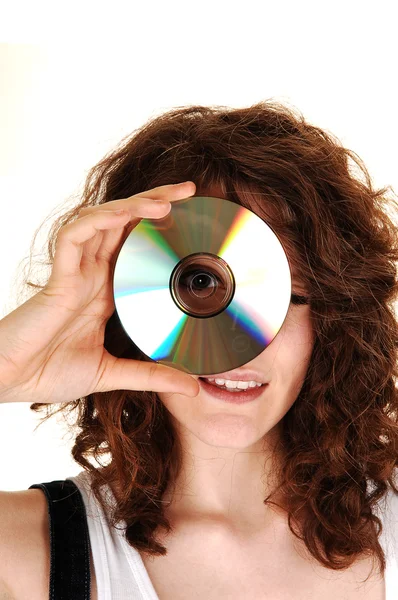 Menina olhando através de um disco . — Fotografia de Stock