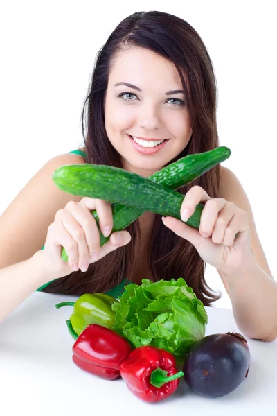 Ung flicka med grönsaker Stockbild