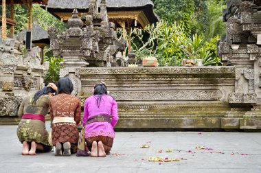 Indonesian woman praying clipart