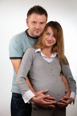 Happy pregnant couple clipart