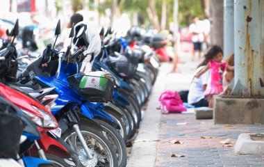 PATTAYA, FEBRUARY 28: Busy scooter parking on Jomtien street, Fe clipart