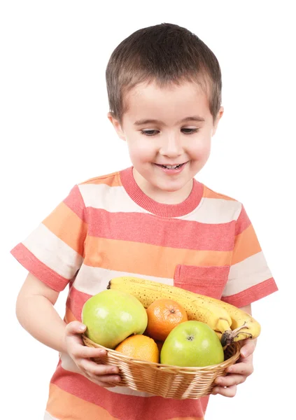 Menino segurando maçãs tangerinas e banana — Fotografia de Stock