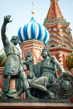 Bronze statue in front of the Cathedral of St. Basil ,focus point on nearest part clipart