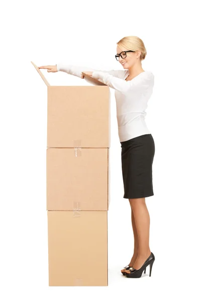 Attractive businesswoman with big boxes — Stock Photo, Image