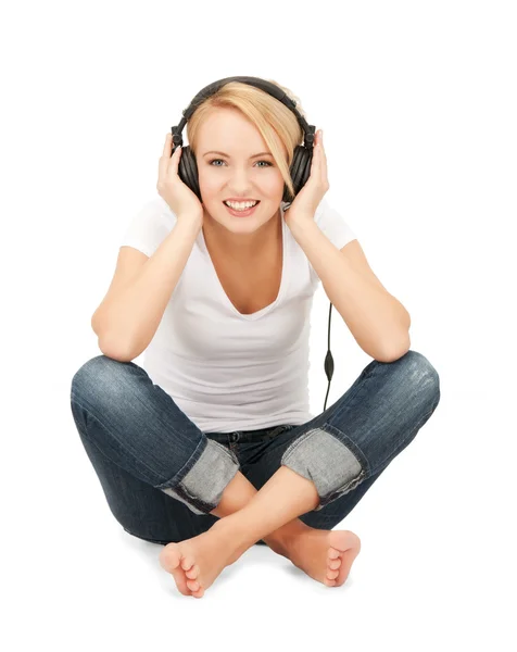 Happy teenage girl in big headphones Royalty Free Stock Images