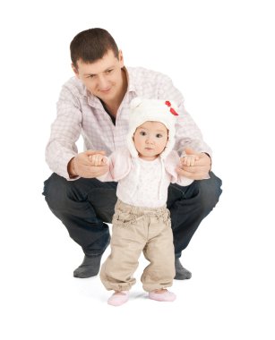 Baby making first steps with father help clipart