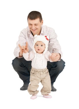 Baby making first steps with father help clipart