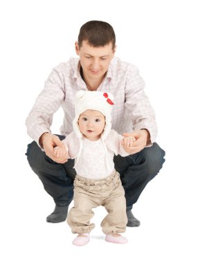 Baby making first steps with father help clipart