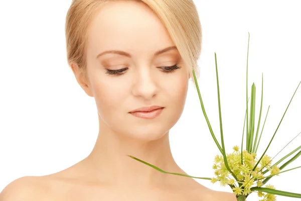 Woman with green sprout — Stock Photo, Image