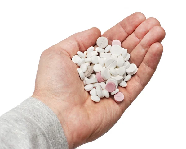 Massa olika piller i handen — Stockfoto