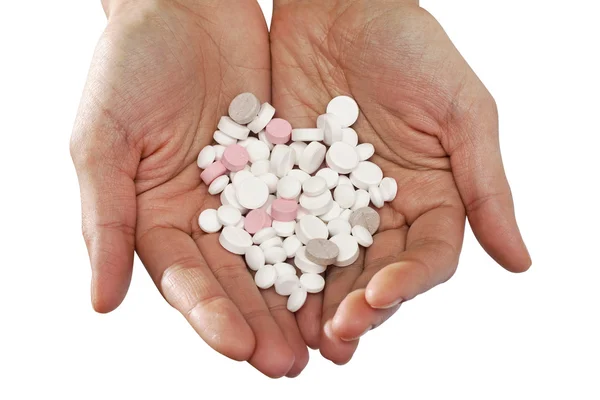 Massa tabletter i händerna en hjärtformad — Stockfoto