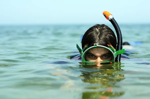 stock image The guy dive under water