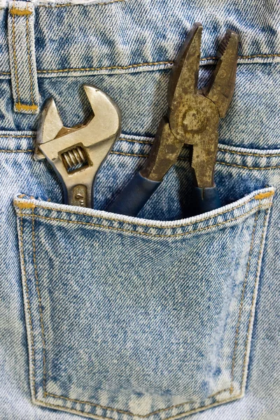 Wrench inside jeans pocket — Stock Photo, Image