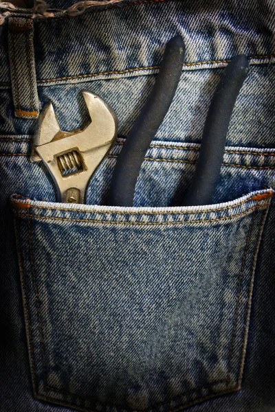 Wrench inside jeans pocket — Stock Photo, Image