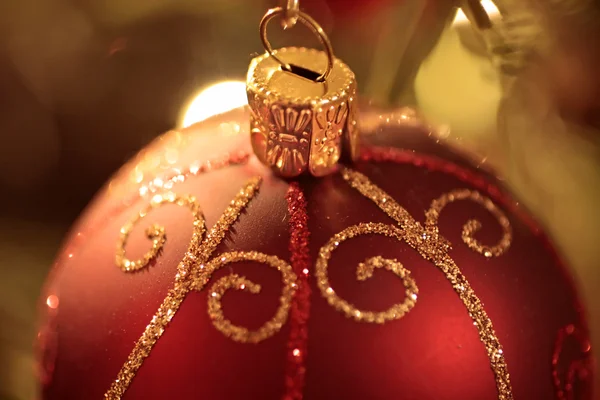 Red Christmas ball on Christmas tree — Stock Photo, Image