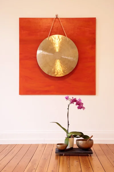 stock image Large Gong and orchid