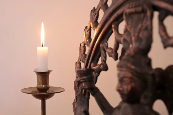 Statue of the goddess Shiva with candle — Stock Photo, Image