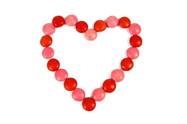 Červené Růžové Bonbony Tvaru Čokoládové Srdce Bílém Pozadí — Stock fotografie