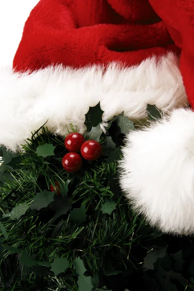 Close up of a Christmas hat around mistletoe — Stock Photo, Image