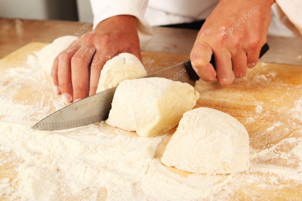 Chef cutting dough — Stock Photo © blackcurrent 5299355