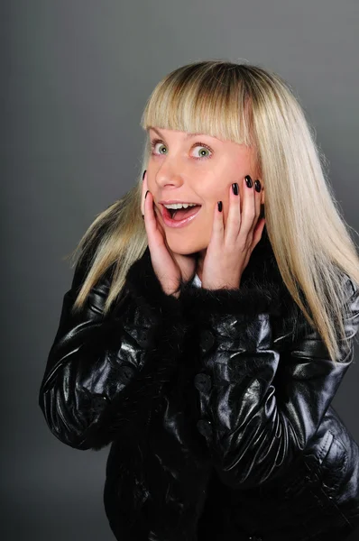 Portrait of a surprised girl in a jacket — Stock Photo, Image