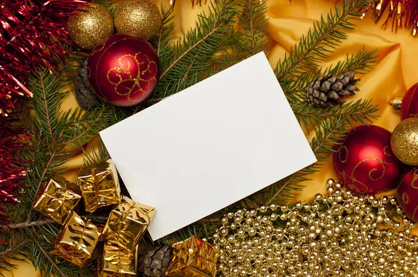 Fondo de Navidad con una tarjeta en blanco Imágenes De Stock Sin Royalties Gratis