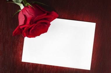 Card with rose on the table