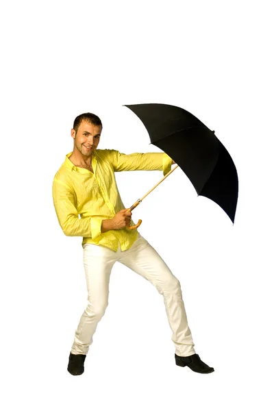 Den unge mannen med ett paraply — Stockfoto