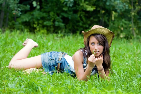 The girl having a rest in a summer garden — Stock Photo, Image