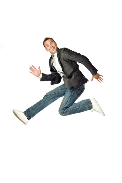 El hombre de negocios saltando sobre un fondo blanco Imagen de stock