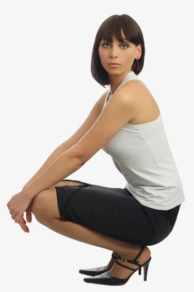 Beautiful woman siting on her haunches — Stock Photo, Image
