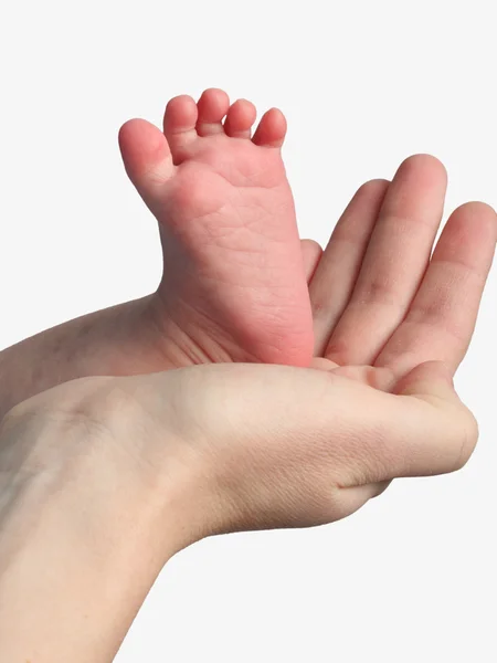 Moeder houden de voeten van haar kind — Stockfoto
